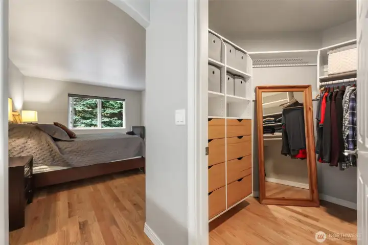 Primary bedroom walk-in closet with built-ins.