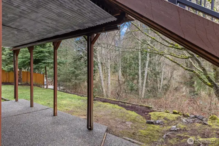Covered patio from new deck above over looking price greenbelt with no neighbors looking in from behind.
