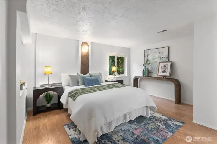 Lower-level primary bedroom in the southeast corner of the home.