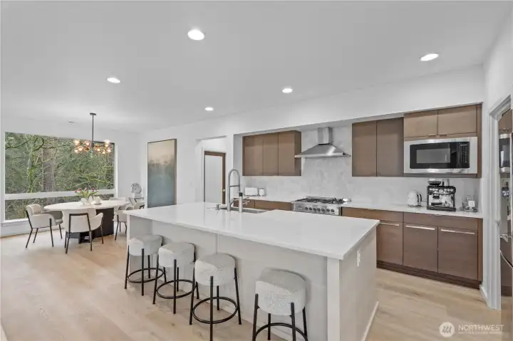 Quartz counters and top of the line new flooring throughout the kitchen