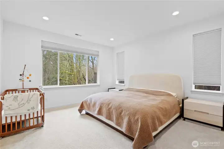 Primary suite on the back side of the house on the main floor. Look out on beautiful trees and privacy!