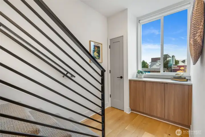 Storage on the primary bedroom landing before you go up to see the roof deck.