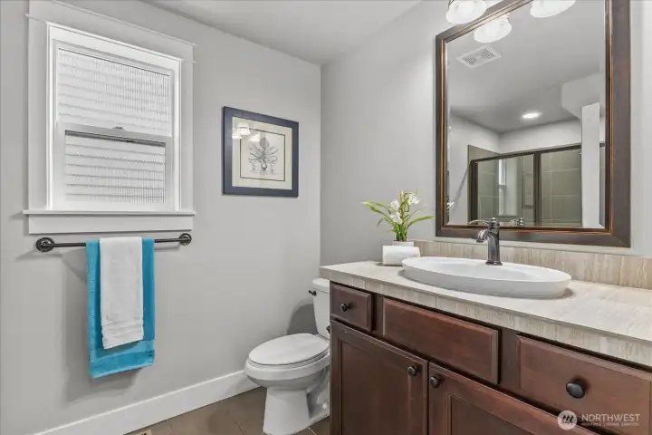 Main-Level 3/4 Bath - Stylish convenience on the main level.