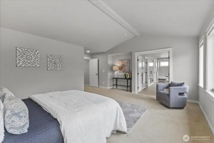 A beautiful primary bedroom where space, light, and tranquility come together.