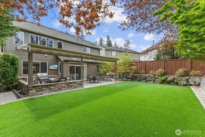 Low-maintenance luxury turf, with room to host and unwind.