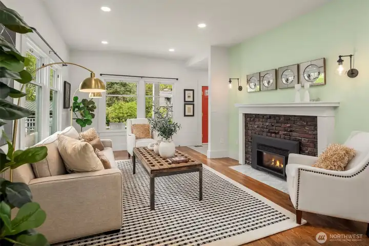 The gas fireplace insert is new. The original brick surround gives it a vintage touch!