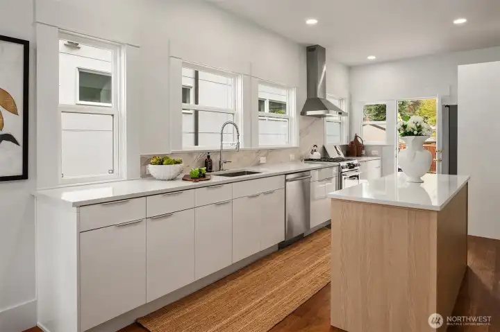 Brand new kitchen with soft close cabinetry, oodles of storage, quartz counters.