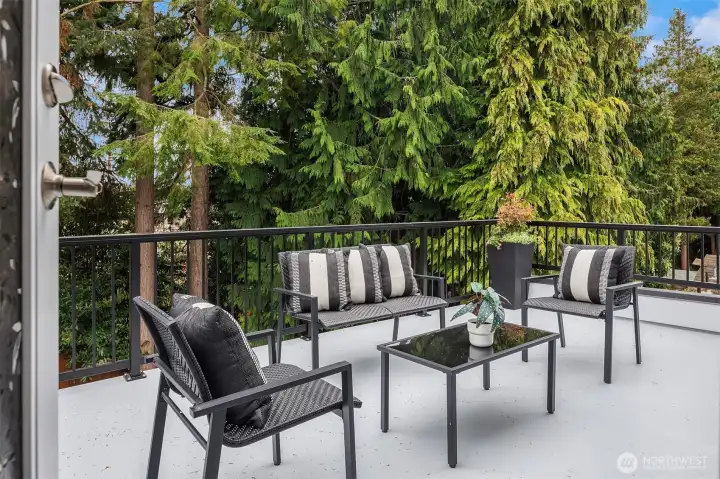 Add loungers to soak up the sun! Catch glimpses of the Sound from this deck.