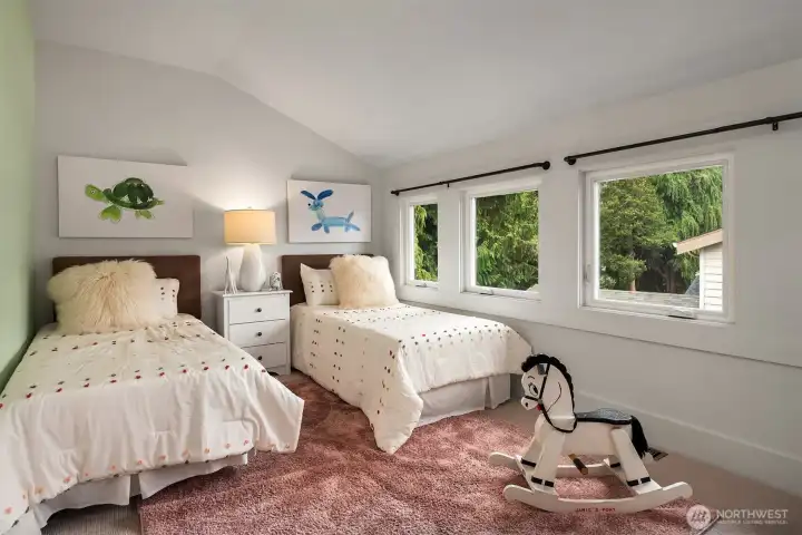 Large bedroom with walk-in closet, room for a big bed (or twin beds!) and has a peek-a-boo view.