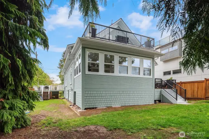 Another view of the enclosed sunroom and roof deck.