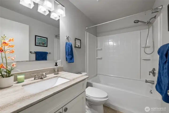 Guest bath features a deep soaking tub