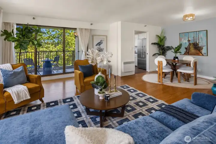 Spacious living area with balcony and adjacent dining room