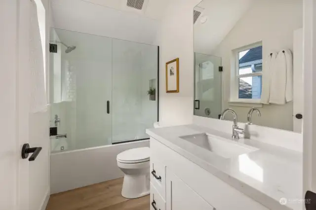 Second floor bathroom features a bathtub and designer finishes.