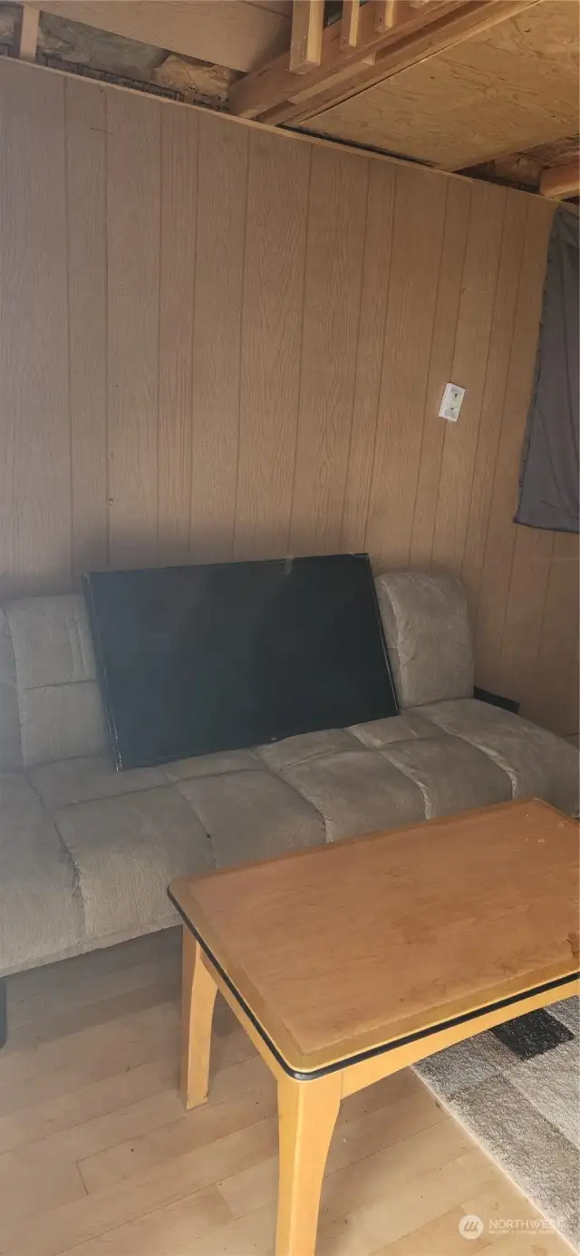Futon & coffee table.  The TV on the futon goes out to the Gazebo