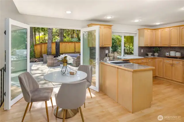Kitchen and dining area open to patio