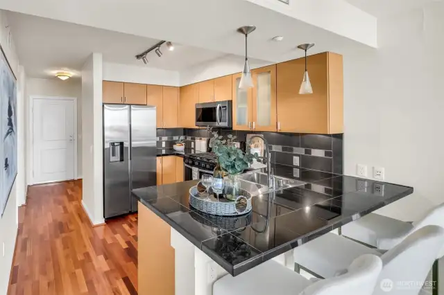 Gorgeous chef's kitchen, New Gas Range, Samsung Fridge, Granite Counters and Art Deco lighting including undercabinet & overhead Pendant w/Day Bar seating!