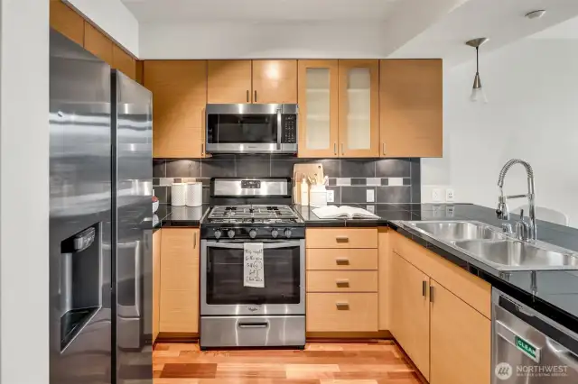 Gorgeous chef's kitchen, New Gas Range, Samsung Fridge, Granite Counters and Art Deco lighting including undercabinet & overhead Pendant w/Day Bar seating!