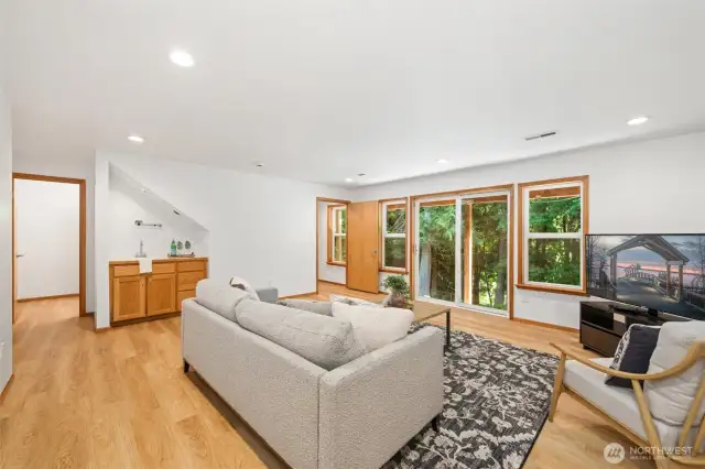 Downstairs, enjoy two more bedrooms, a spacious family room, and an additional 575 sq ft of unfinished flex space currently set up as a home gym.