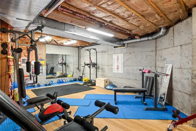 The unfinished 575 sq ft room is being used as a home gym.