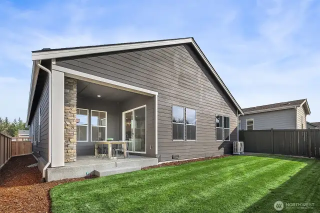 Rear yard and covered patio. Photo taken from similar model
