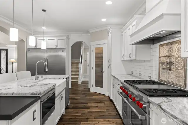 Simply stunning—this space must be seen in person to be fully appreciated. High-end appliances and luxurious slab granite countertops make this room truly stand out.