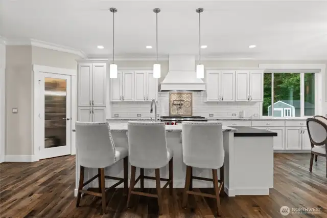 Additional seating at the island offers the perfect spot for guests to gather and connect while you work in the kitchen.