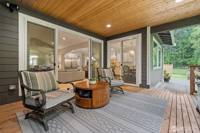 The comfortable outdoor living area has been enhanced with a gas fireplace and pre-wiring for a TV, creating the perfect space to relax year-round. Enjoy the fresh outdoor air—even during the rainy season—in this cozy, all-season retreat.