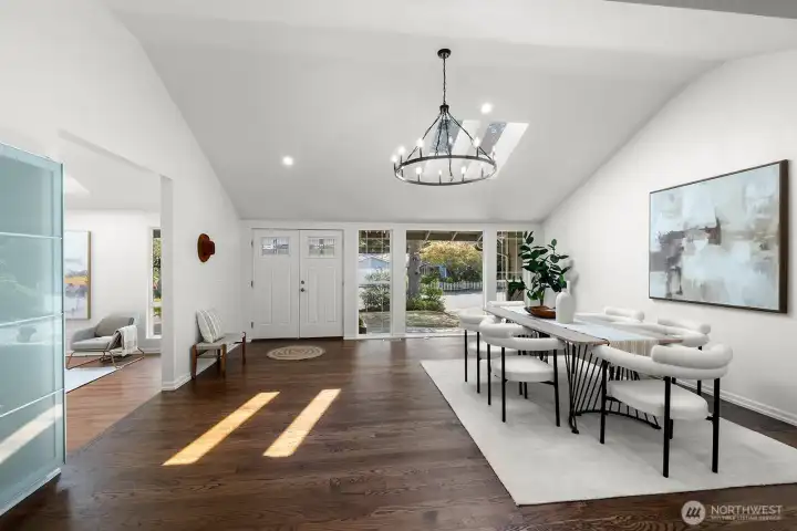 Step inside to an open layout with vaulted ceilings. The kitchen, dining, and living areas all flow together.