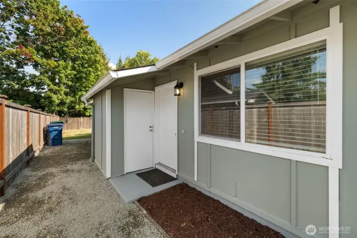 Main entrance easily accessed with fully-fenced yard.