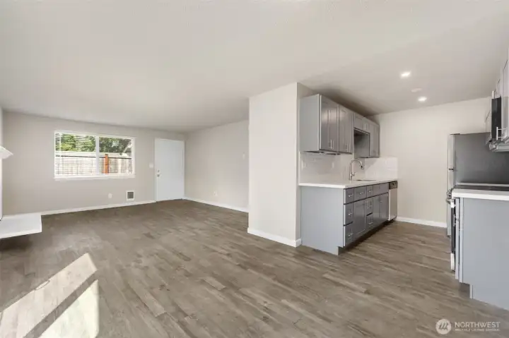 Enter in through the main entrance and be greeted by an open floor plan with fire place!
