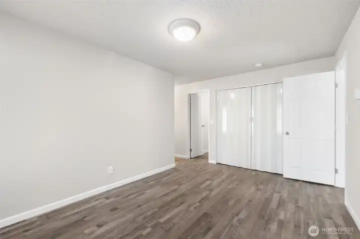Pass through the living room and into another multi-use room with access to laundry and bathroom.