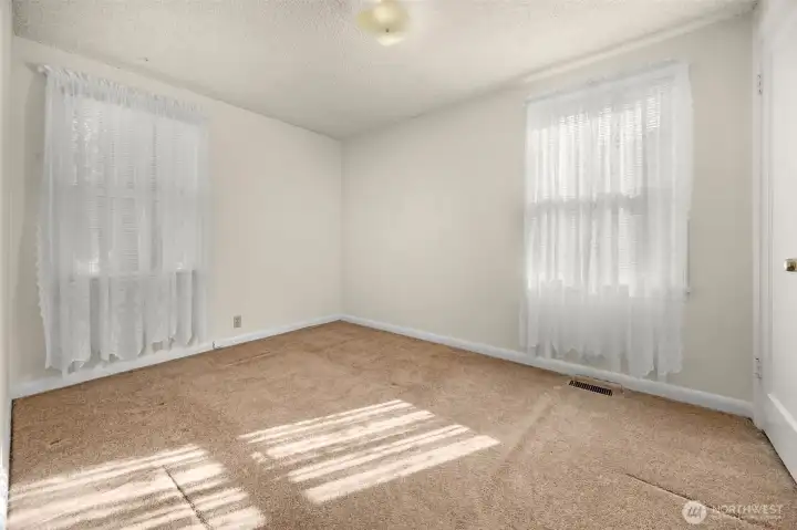 Bedroom #2 located at SE corner of home, near main bathroom.