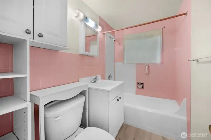 Full bathroom covenienty located by Bedrooms 1 & 2.