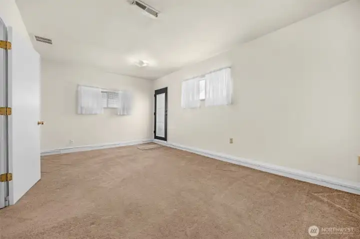 Family room located at NW corner of home with access to carport.