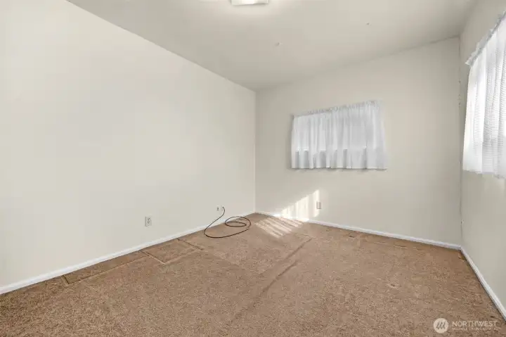 Bedroom #3 (or office) at opposite end of home from bedrooms #1 & 2, adjacent to family room.