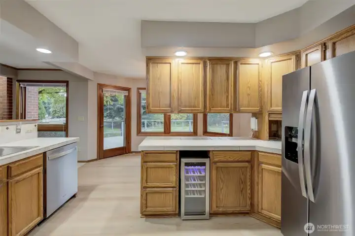 Updates in kitchen include ss dishwasher, ss refrigerator, and ss wine fridge!