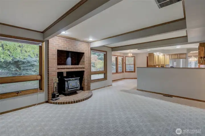 The spacious, cozy family room enjoys access to the breakfast room and kitchen!