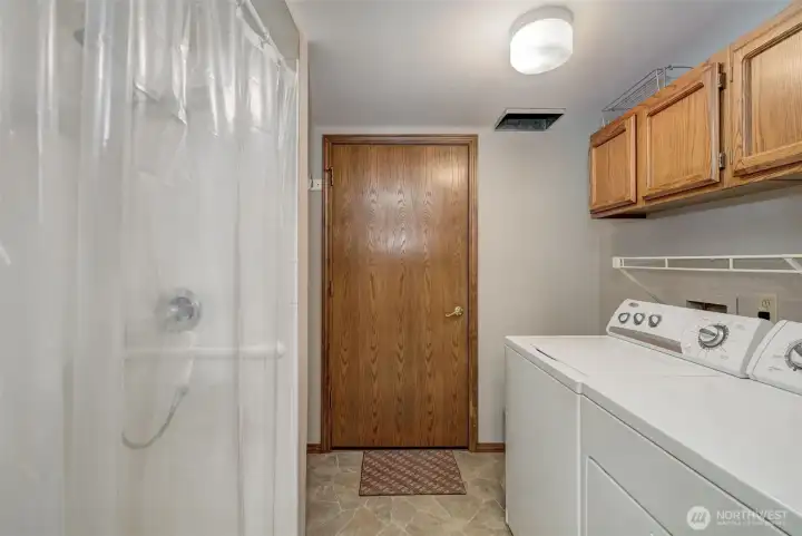 Main floor utility room offers a lg shower, laundry, storage and room for a bonus fridge/freezer! Oh-and a laundry chute!