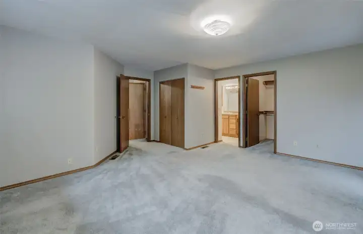 Primary suite offers plenty of space for everything, plus a massive walk-in closet, 2nd closet, covered balcony, and full-size attached bath!