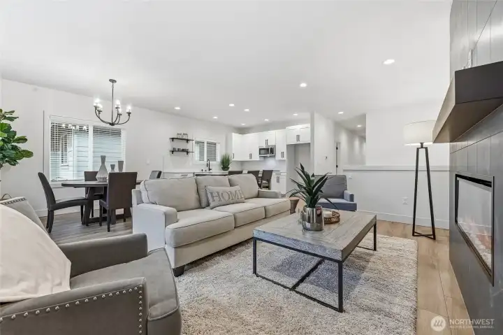 great room upstairs with classy fireplace