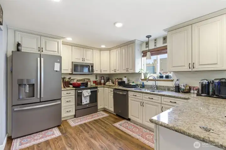 Beautiful kitchen with newer fridge and new dishwasher