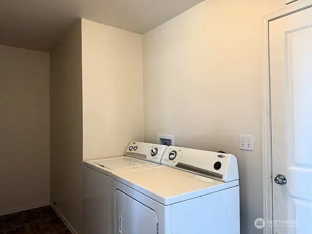Large laundry room with garage access.
