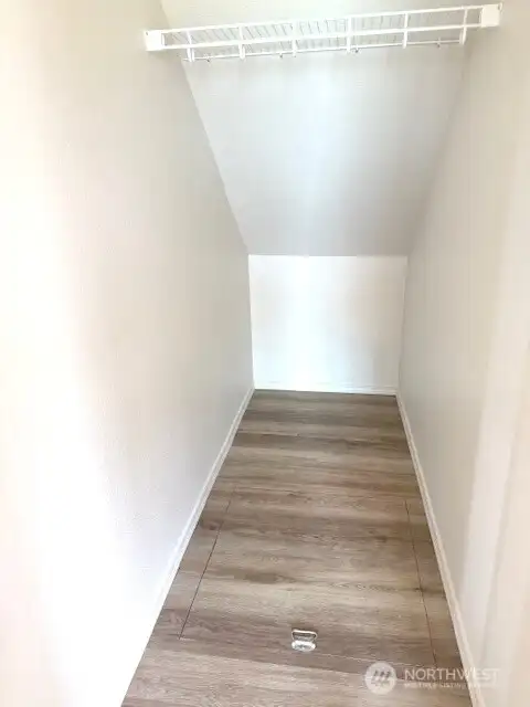 Coat closet with access to the crawl space.