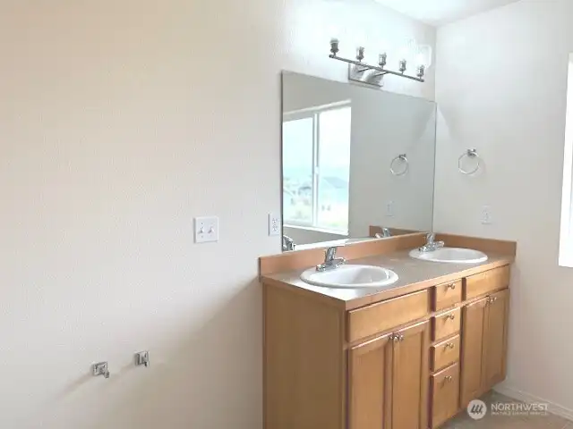 Double vanity in the primary bathroom.