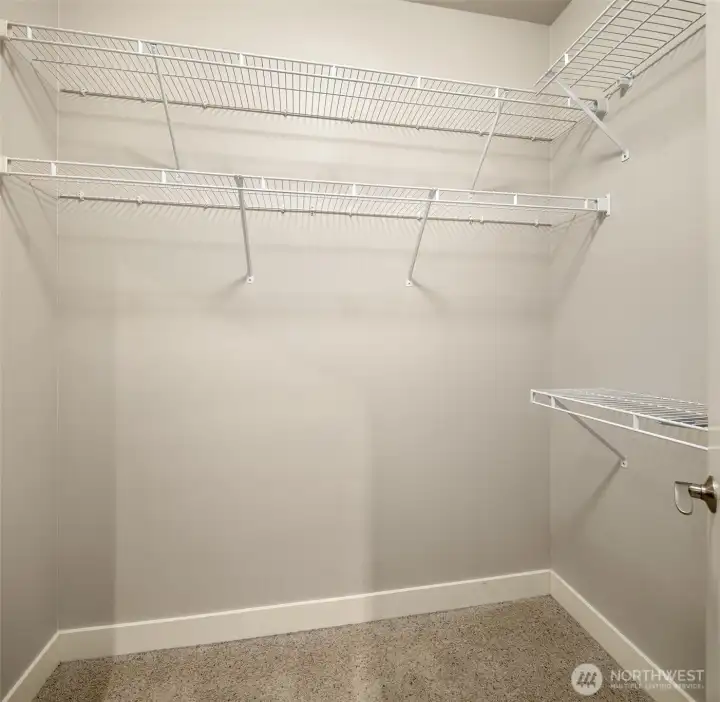 Primary bedroom walk-in closet