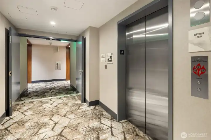 Elevator adjacent to the unit that only services a limited # of units and goes down to the parking spaces.