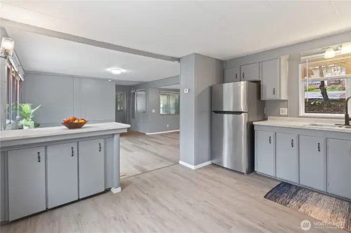 Updated kitchen with abundant cabinetry, generous counter space, and an open-concept design. Updated kitchen with abundant cabinetry, generous counter space, and an open-concept design.