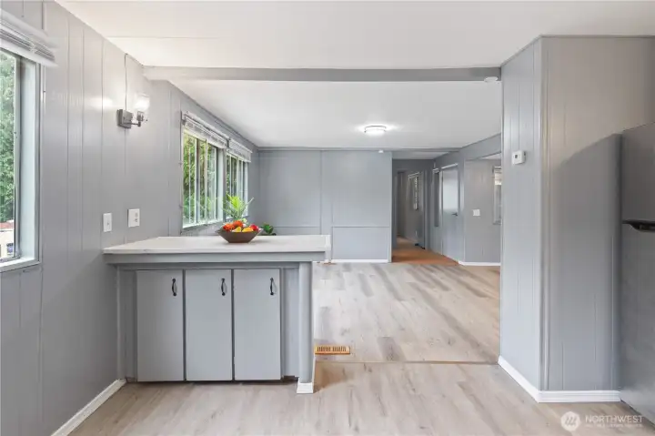 Spacious open-concept layout connecting the living room, dining area, and kitchen. Spacious open-concept layout connecting the living room, dining area, and kitchen.