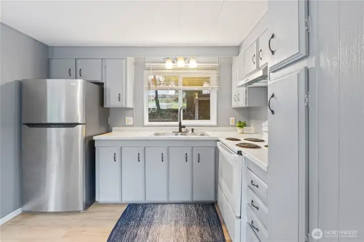 Additional view highlighting ample storage and efficient kitchen layout. Additional view highlighting ample storage and efficient kitchen layout.