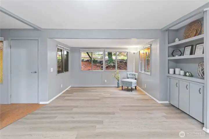 Comfortable living room with built-in storage and plenty of natural light. Comfortable living room with built-in storage and plenty of natural light.